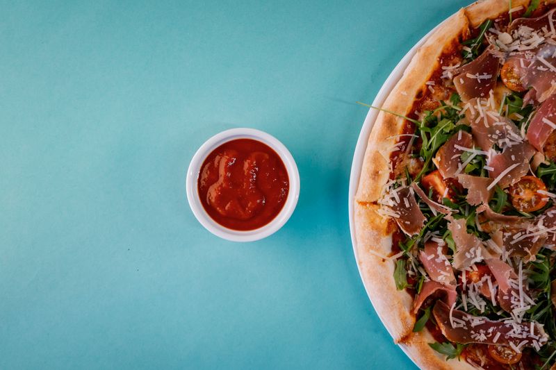 Pesto Prosciutto Arugula pizza Italian style